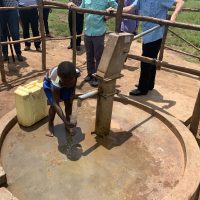 9-12-22_Kiboga Borehole19-Nelson Pumping Water