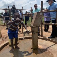 9-12-22_Kiboga Borehole22-Nelson Pumping Water