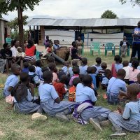 9-15-22_Visiting Kaccumu School Children31-Lewi sharing